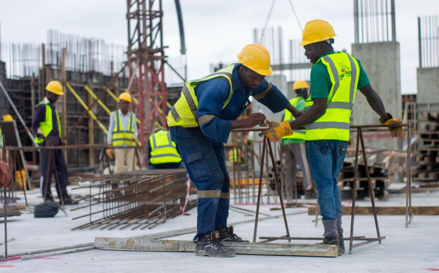 Construction workers collaborating at an active job site